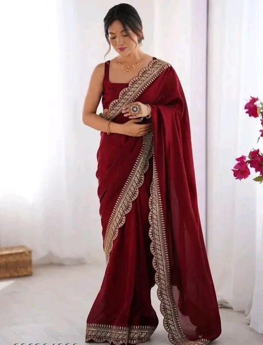 Red party wear saree with sleeveless blouse