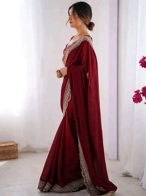 Red party wear saree with sleeveless blouse